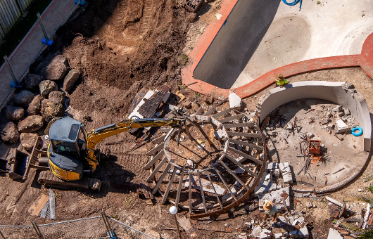 excavator-demolishing-swimming-pool-at-residential-2026-09-21-13-33-27-utc
